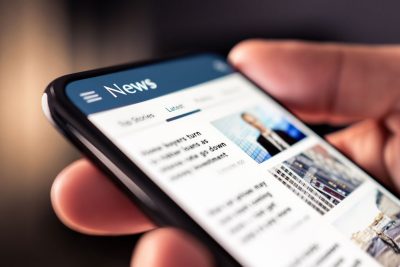 News stories on a phone screen
